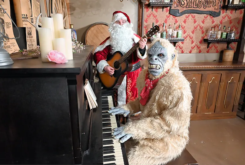 santa and a yeti singing a song