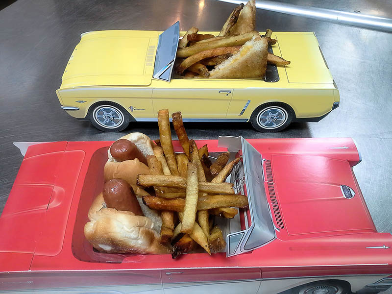trays shaped like cars filled with french fries