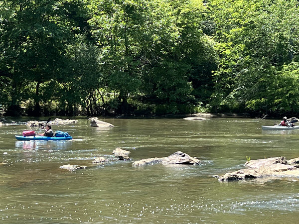 Kayakers paddle the Haw River near Burlington NC