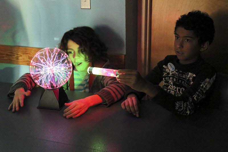 Children conduct experiments with electricity at the Catawba Science Center in Hickory, NC.