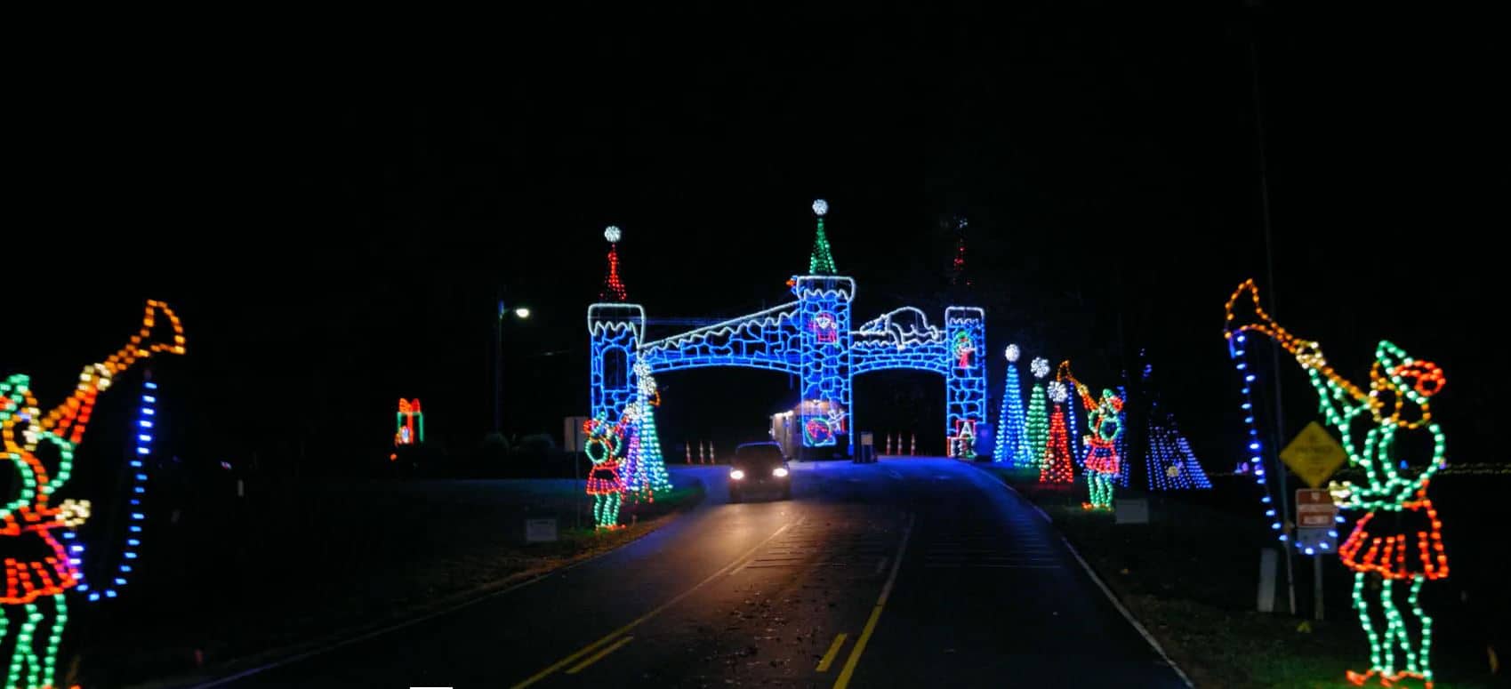 Lighted castle entrance spans the road at the Tanglewood Festival of Lights, one of the best Christmas lights in NC