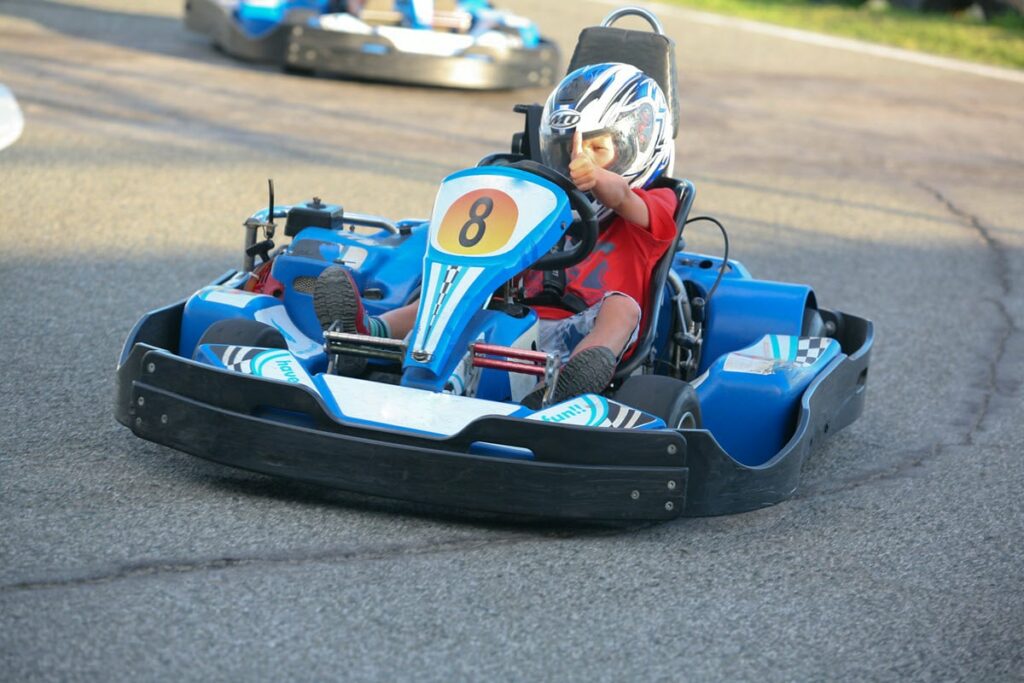boy gives a thumbs up for go-kart racing at one of the best fun parks in North Carolina