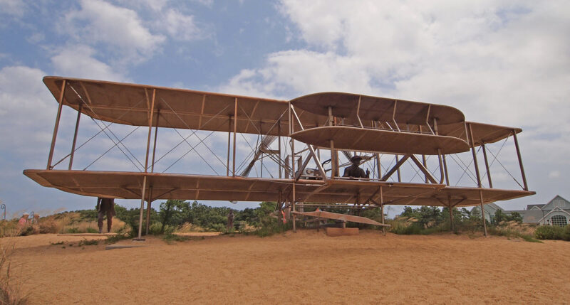 Visitors inspect a replica of the Wright flyer