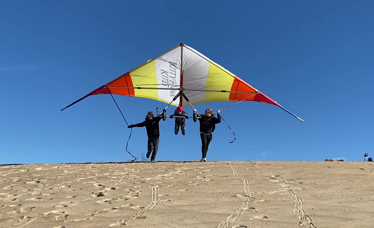 Student takes flight on a hang gliding lesson in the Outer Banks