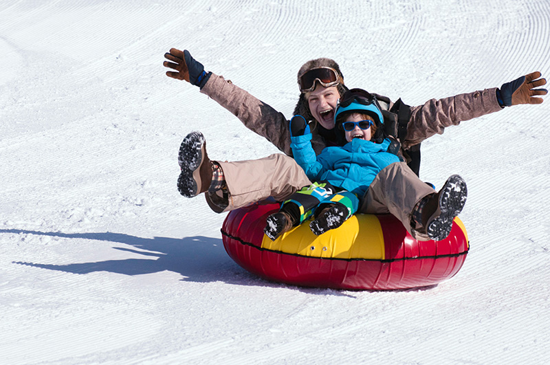 mother and child snow tubing