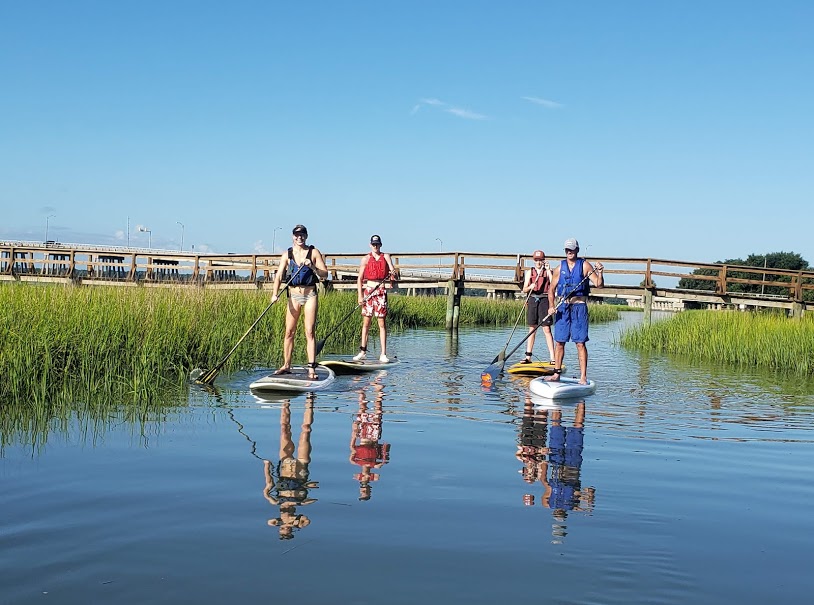 people on paddleboards enjoying some time in the wetlands of ACE Basin