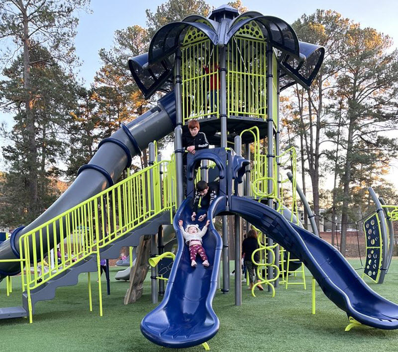 Kids enjoy the slide at Kiwanis Children's Park in Sanford