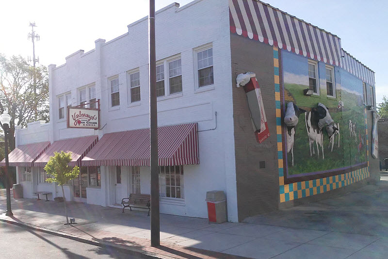 Cow mural adorns the wall of Yarboroughs Homemade Ice Cream