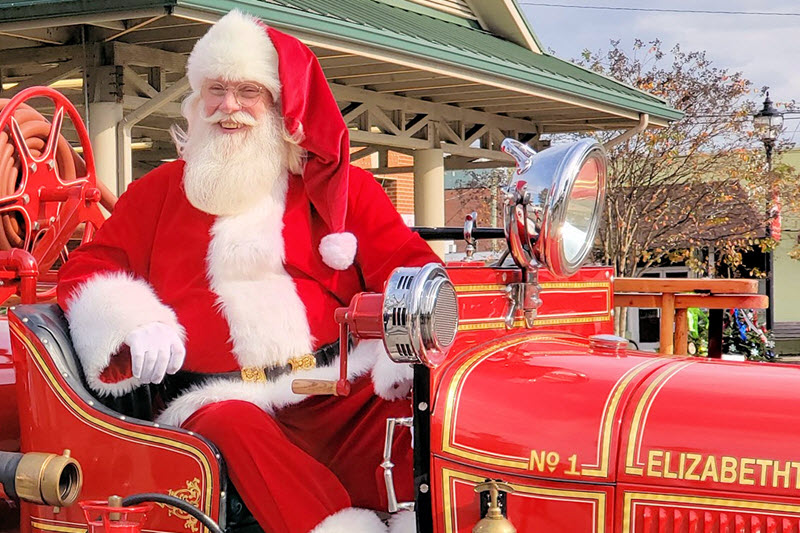 santa on a vintage red firetruck rides in the Elizabethtown Christmas parade -- the hallmark of a Bladen County Christmas