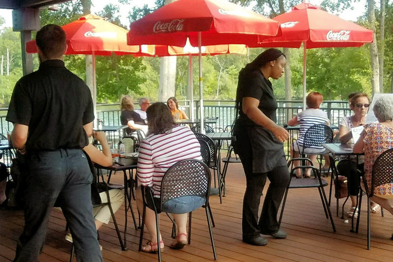 umbrellas cast shade on the patio tables at J.R. Cash's Grill and Bar