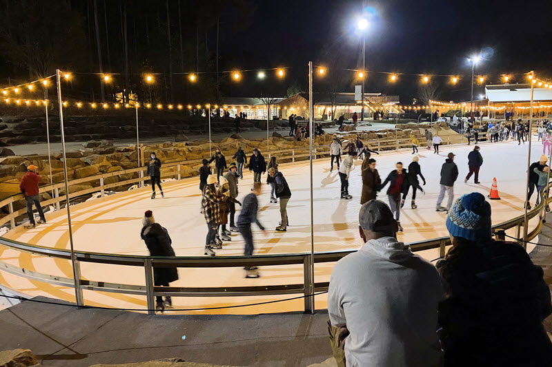 Ice skaters enjoy the rink near Mount Holly