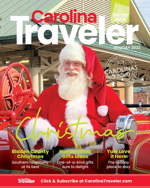Santa in a red firetruck graces the cover of the Carolina Traveler Magazine Holiday issue 2022