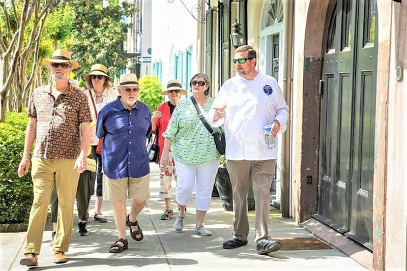 A group tours Charleston for a walking food tour