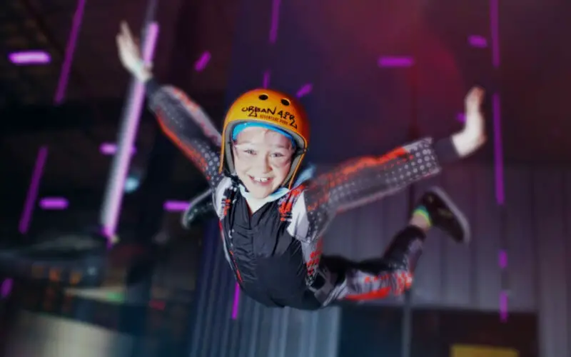 Happy kid indoor skydiving at Urban Air Adventure Park in the Carolinas