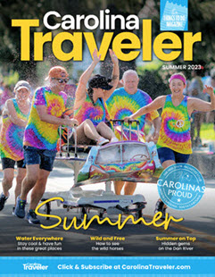 Crowds cheer for the Beaufort Water Festival on the cover of Carolina Traveler summer 2023