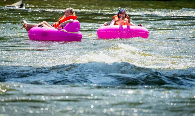 Two women tubing at the Madison River Park in Madison, NC