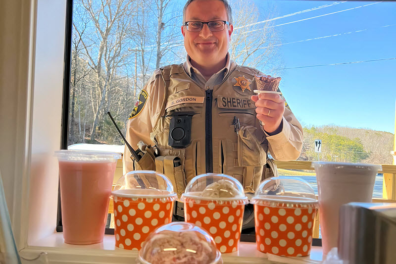 A deputy enjoys an ice cream cone in Danbury, NC