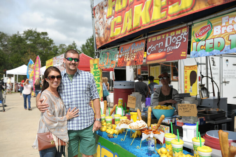 Couple at a corn dog stand at the NC Muscadine Festival