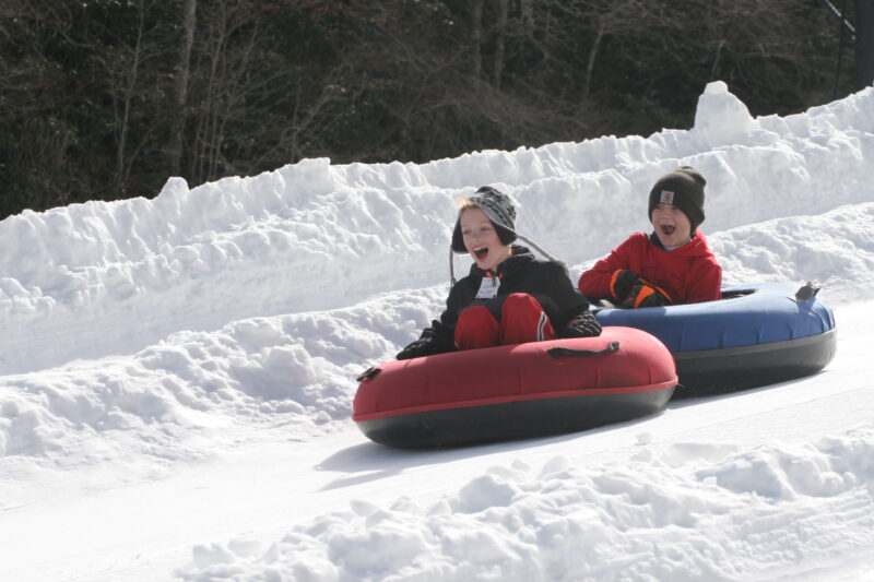 Children snow tubing at Hawksnest