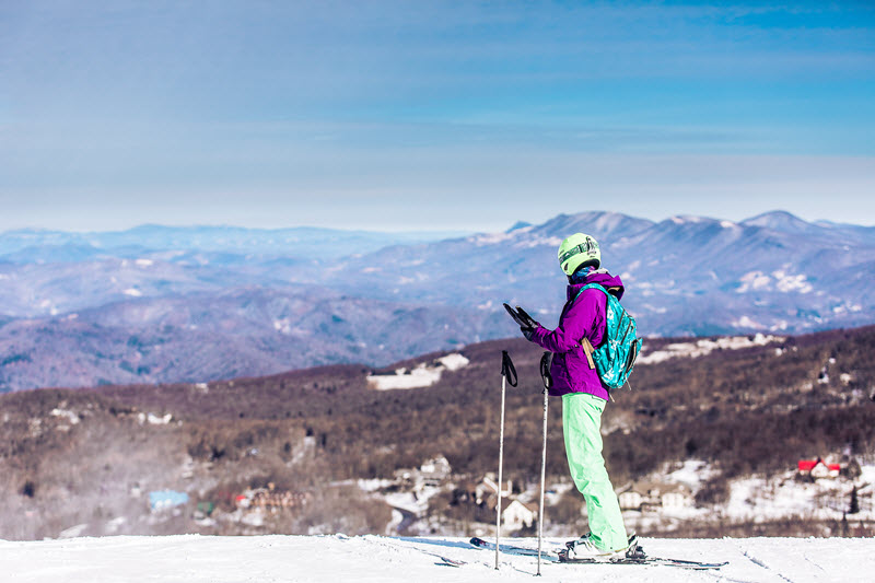 A skier contemplates their run down Beech Mountain in Banner Elk, NC