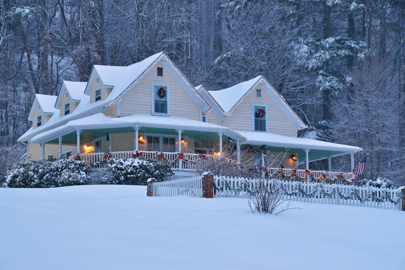 Snow blankets the grounds and roof of Perry House bed and breakfast in Banner Elk, NC