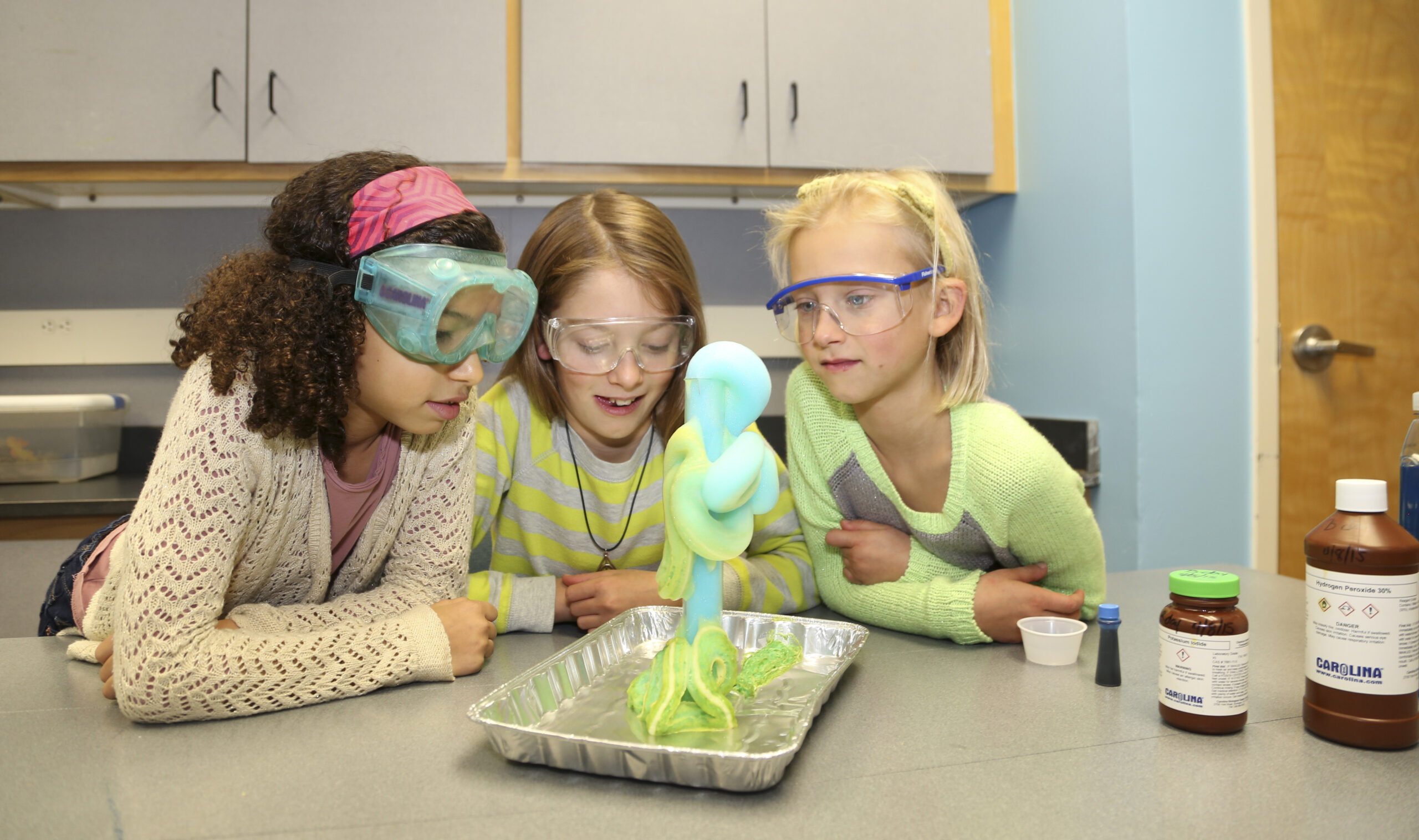 Young girls watching a science experiment at Catawba Science Center