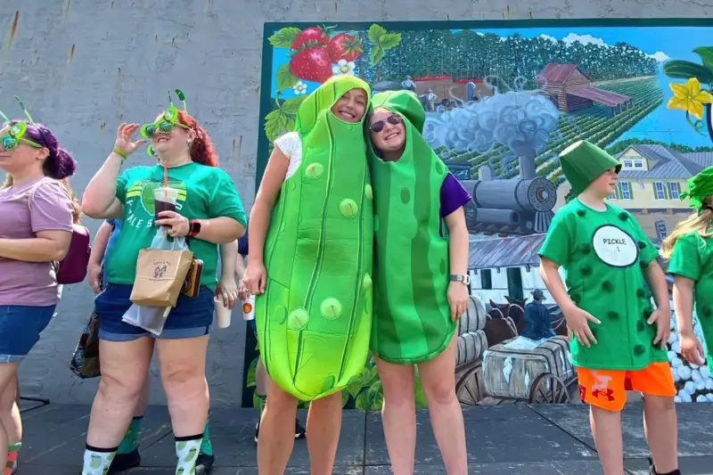Two teens dressed as pickles at NC Pickle Fest