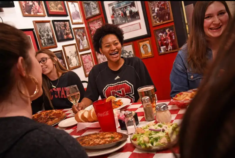 NC State students eating and enjoying March Madness