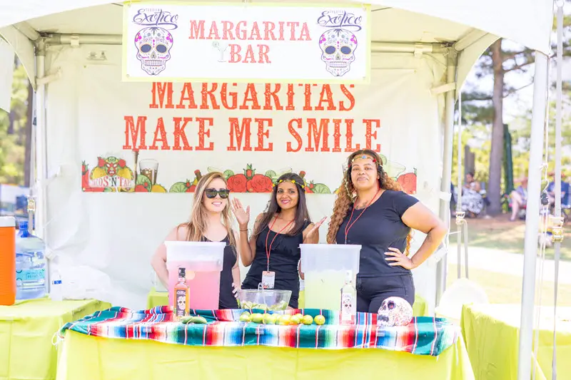 Three woman at the margarita stand