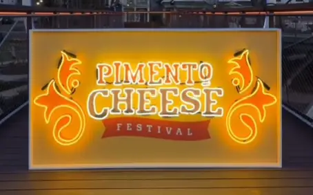 Pimento Cheese Festival neon sign at Downtown Cary Park