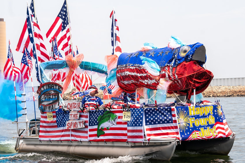 Taking part in a patriotic boat parade is one of many fun 4th of July activities in the Carolinas