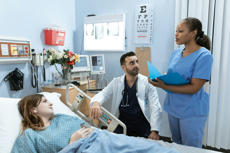 Doctor and surgeon having a discussion with a patient