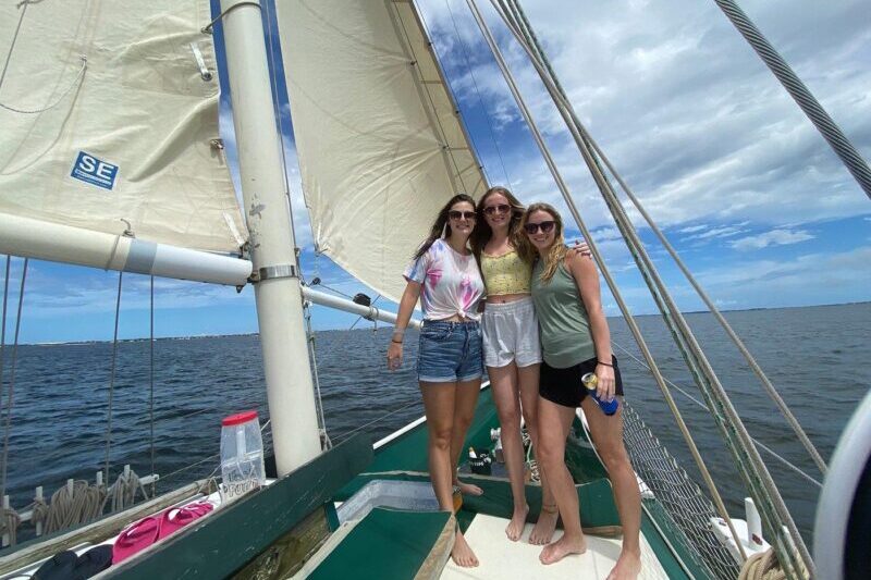 3 friends posing on the Downeast Rover schooner