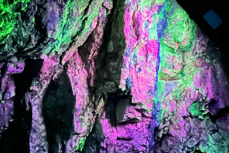 Blacklight display at the Emerald Village mine tour