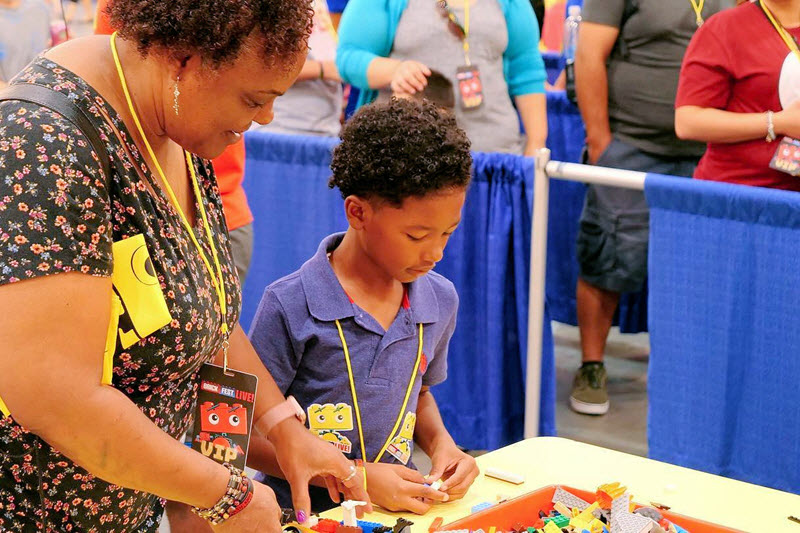 Mother and son build with LEGOs at Brick Fest Live