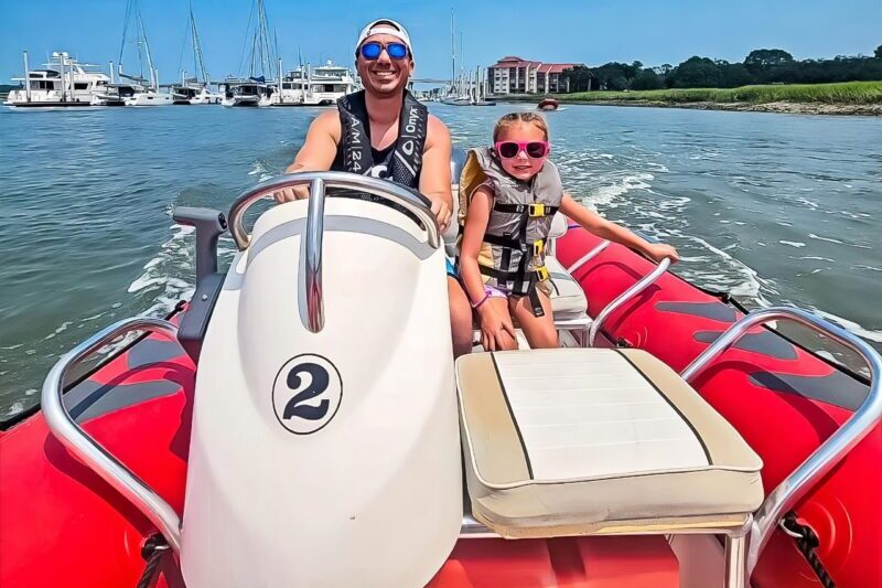 Father and daughter enjoying a Lowcountry Watersports mini boat