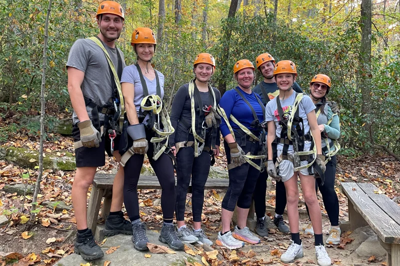 A Gorge zip line tour group wearing harnesses and helmets.