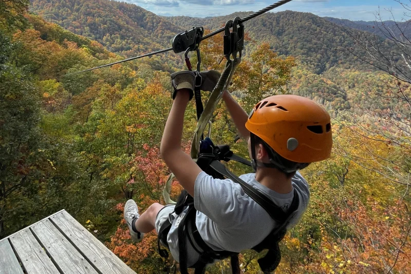 Augie steps off the zipline platform at The Gorge