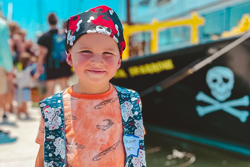 Kid outside Hilton Head Pirate Cruise, one of our favorite pirate adventures