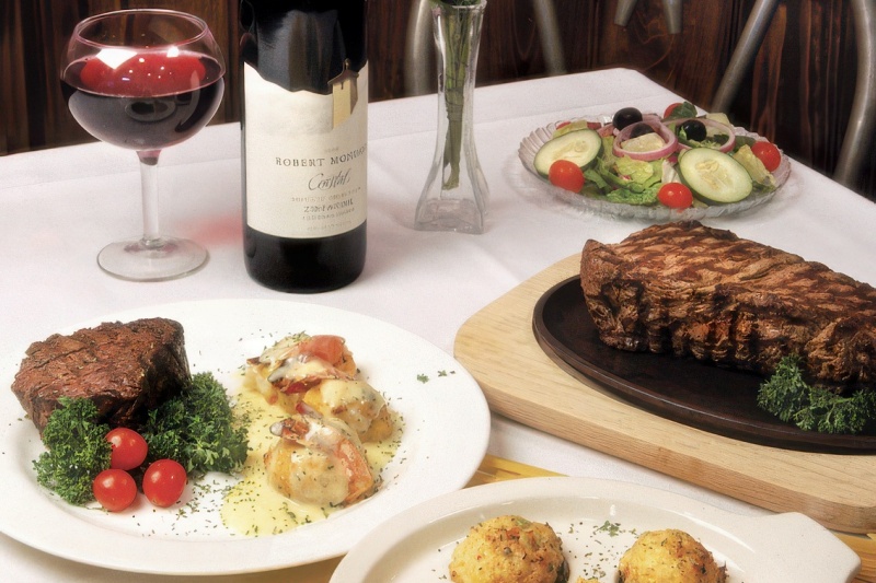A table set with wine and steak at Angelo's in Myrtle Beach, SC.