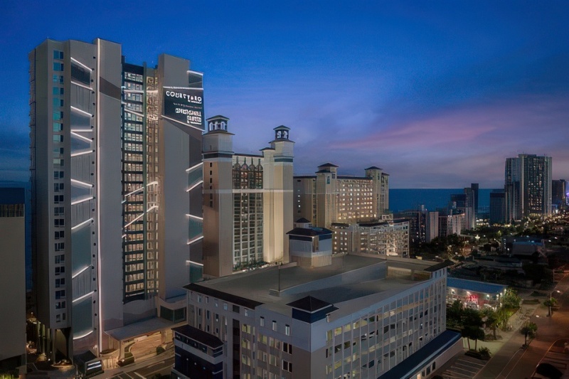 Springhill Suites Oceanfront in Myrtle Beach, SC, at night.
