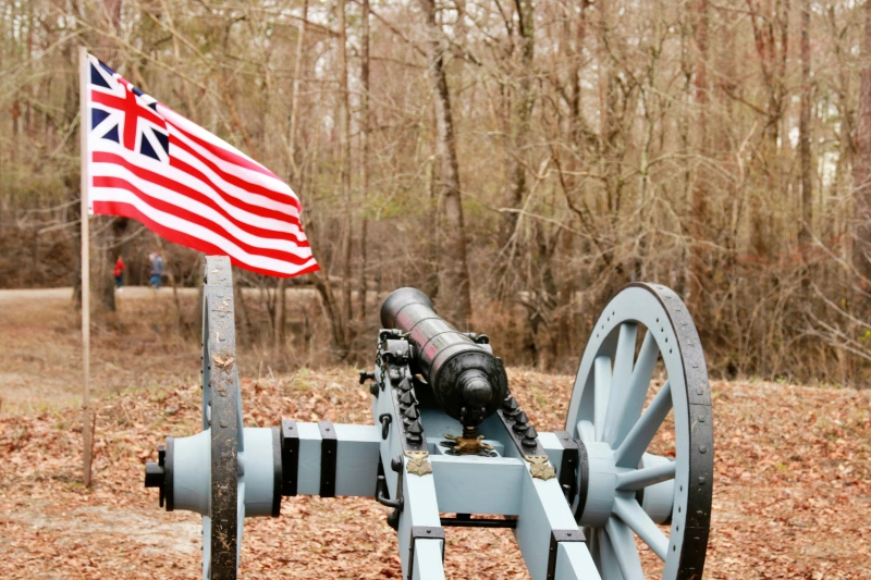 Cannon and colonial flag at Moores Creek National Battlefield near Burgaw, NC