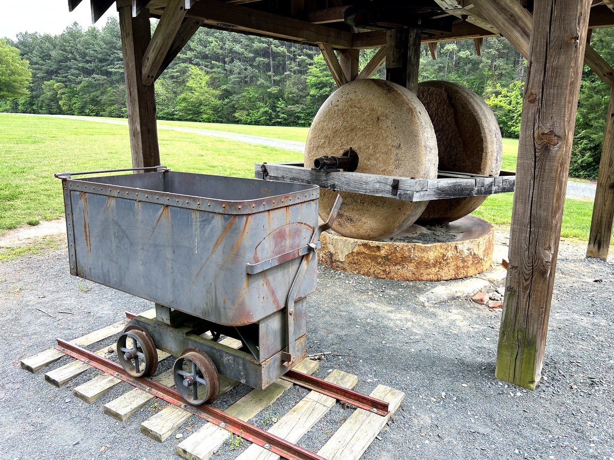 Old mining cart and stone wheel in Gold Hill